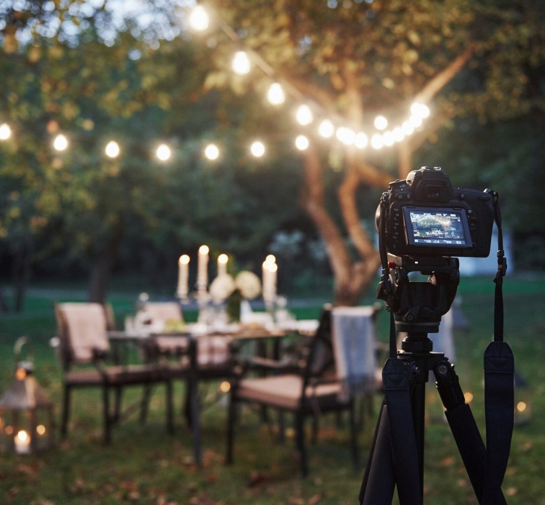 professional-equipment-camera-tripod-stand-field-front-prepared-table-evening-time_146671-14420